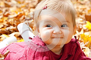 Autumn baby girl smiling