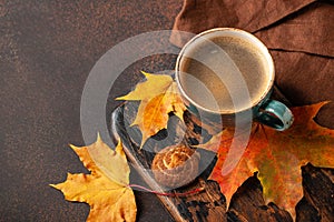 Autumn background with cup of black coffee and fall decoration