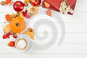 Autumn background, cup of cappuccino, books, space for text.