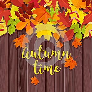 Autumn background. Frame for text decorated with autumn leaves. Wooden backgroun with autumn leaves and lettering