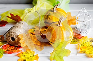autumn background with pumpkins and leaves and candle