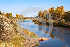 Autumn blue sky bend in the river with sandy bank in Vologodskaya oblast, Russia