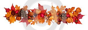 Autumn border of colorful fall leaves, nuts and pine cones, above view isolated on white