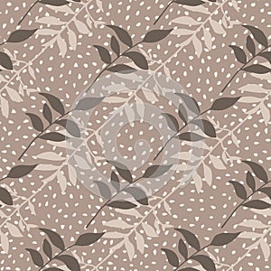 Autumn branch with foliage seamless pattern. Creative fall artwork in beige and brown tones with dotted background