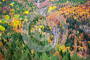 Autumn Bujaruelo Ordesa waterfal in colorful fall forest Huesca