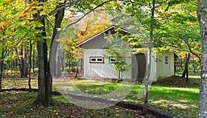 Autumn cabin in the wood