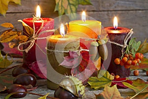 Autumn candles with leaves vintage abstract still life