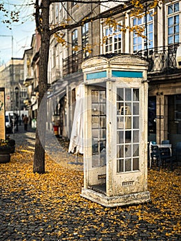 Autumn city landscape with typical white telephone booth in Chaves, Vila Real, Tras os Montes, Portugal photo