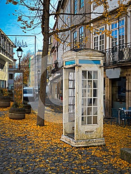 Autumn city landscape with typical white telephone booth in Chaves, Vila Real, Tras os Montes, Portugal photo