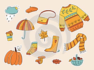 Autumn color doodle stickers. Hand drawn vector set of sketches: jumper, umbrella, boots, cloud, leaves, pumpkins, mushrooms.