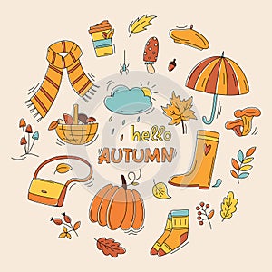 Autumn color doodles in circle shape. Hand drawn vector set of sketches: pumpkin, cloud, mushrooms, leaves, scarf, umbrella.