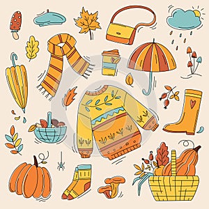 Autumn color doodles. Hand drawn vector set of sketches: jumper, umbrella, boots, cloud, mushrooms, leaves, pumpkins. Autumn