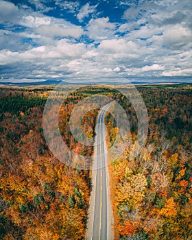 Autumn color and road in the mountains near Abbot, Maine