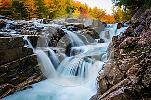 Autumn color and waterfall at Rocky Gorge, on the Kancamagus Highway, in White Mountain National Forest, New Hampshire. photo