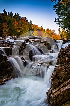 Autumn color and waterfall at Rocky Gorge, on the Kancamagus Highway, in White Mountain National Forest, New Hampshire.