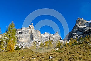 Autumn colors in Dolomite Alps, yellow mountain landscape
