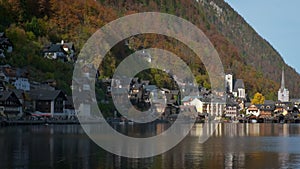 Autumn colors in famous tourist destination idillyc town Hallstatt in Austrian mountain Alps
