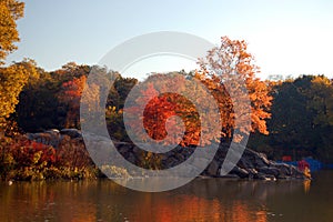 Autumn colors reflect in the waters of a lake