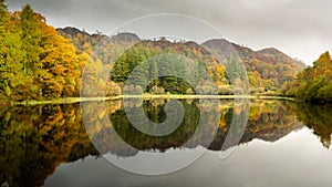 Autumn Colours and Reflections at Yew Tree Tarn in the English Lake District National Park