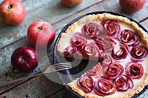 Autumn comfort food. Homemade imperfect pie with apple roses in