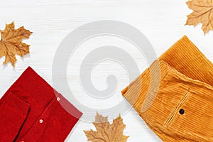 Autumn comfortable clothes. Trendy corduroy orange pants and warm red jacket