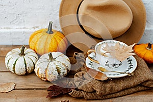 Autumn composition with coffee, autumn leaves, warm sweater