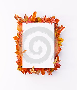 Autumn composition of colorful leaves with white blank paper. Flat lay, top view, copy space 3d render