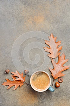 Autumn Composition with Cup of Coffee and Autumn Leaves on Stone or Concrete Background
