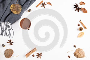 Autumn composition. Cup of coffee, blanket, autumn leaves on white background. Flat lay, top view copy space