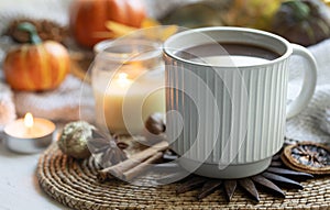 Autumn composition with a cup of hot drink close-up.