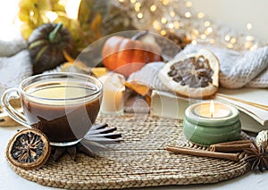 Autumn composition with a cup of tea, yourself and other decorative details.