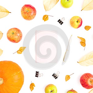 Autumn composition of fall leaves, apple fruit and pumpkin with notebook, pen and clips on white background. Thanksgiving day. Fla