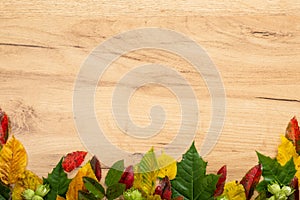 Autumn composition. Frame made of fall autumn leaves on wooden background. Flat lay, top view