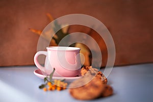 Autumn composition. Hot coffee coco cookies and autumn leaves
