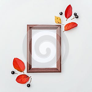 Autumn composition photo frame, colorful leaves on white background