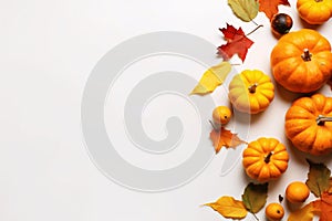 Autumn composition with pumpkins and leaves on white background, top view