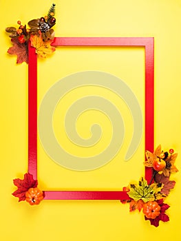 Autumn composition with red frame and fall leaves