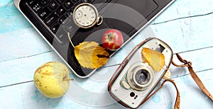 autumn concept, ripe apples, laptop,leaves on blue paint wood surface,top view