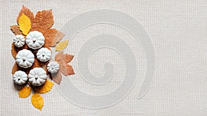 Autumn creative craft background web banner with decorative clay pumpkins and wooden autumn leaves. Decorative pumpkins