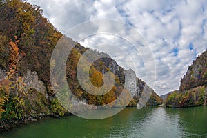 Autumn at the Danube Gorges and Decebal king`s Head sculpted in