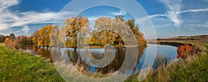 Autumn day above the river Ros`