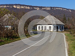 An autumn day, a mountain chalet, a sunny morning, the life of wooden structures, residential buildings falling into disrepair.