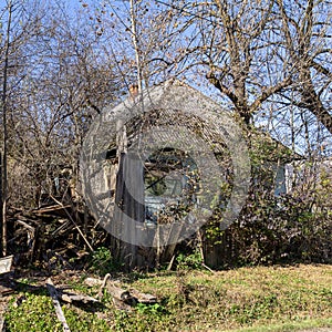 An autumn day, a mountain chalet, a sunny morning, the life of wooden structures, residential buildings falling into disrepair.