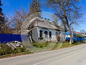 An autumn day, a mountain chalet, a sunny morning, the life of wooden structures, residential buildings falling into disrepair.