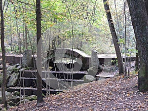 An autumn day in the park, stairs, fallen leaves and an old bridge