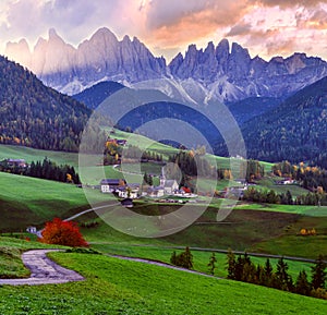 Autumn daybreak Santa Magdalena famous Italy Dolomites village view in front of the Geisler or Odle Dolomites mountain rocks