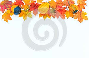 Autumn decor from pumpkins and leaves on a white background.