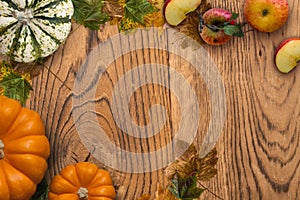 Autumn decoration with fallen leaves and pumpkin