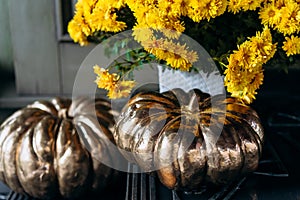 Autumn decoration with pumpkins and flowers on a street in a European city