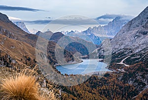 Autumn Dolomites mountain view from hiking path betwen Pordoi Pass and Fedaia Lake, Italy